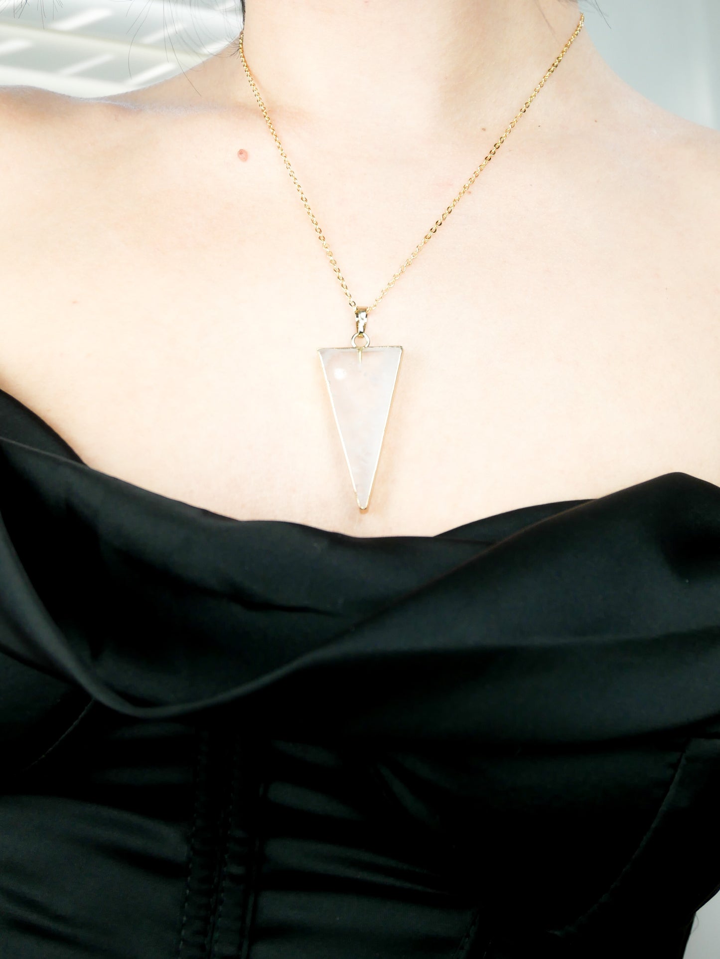 Clear Quartz triangle pendant on a gold plated necklace