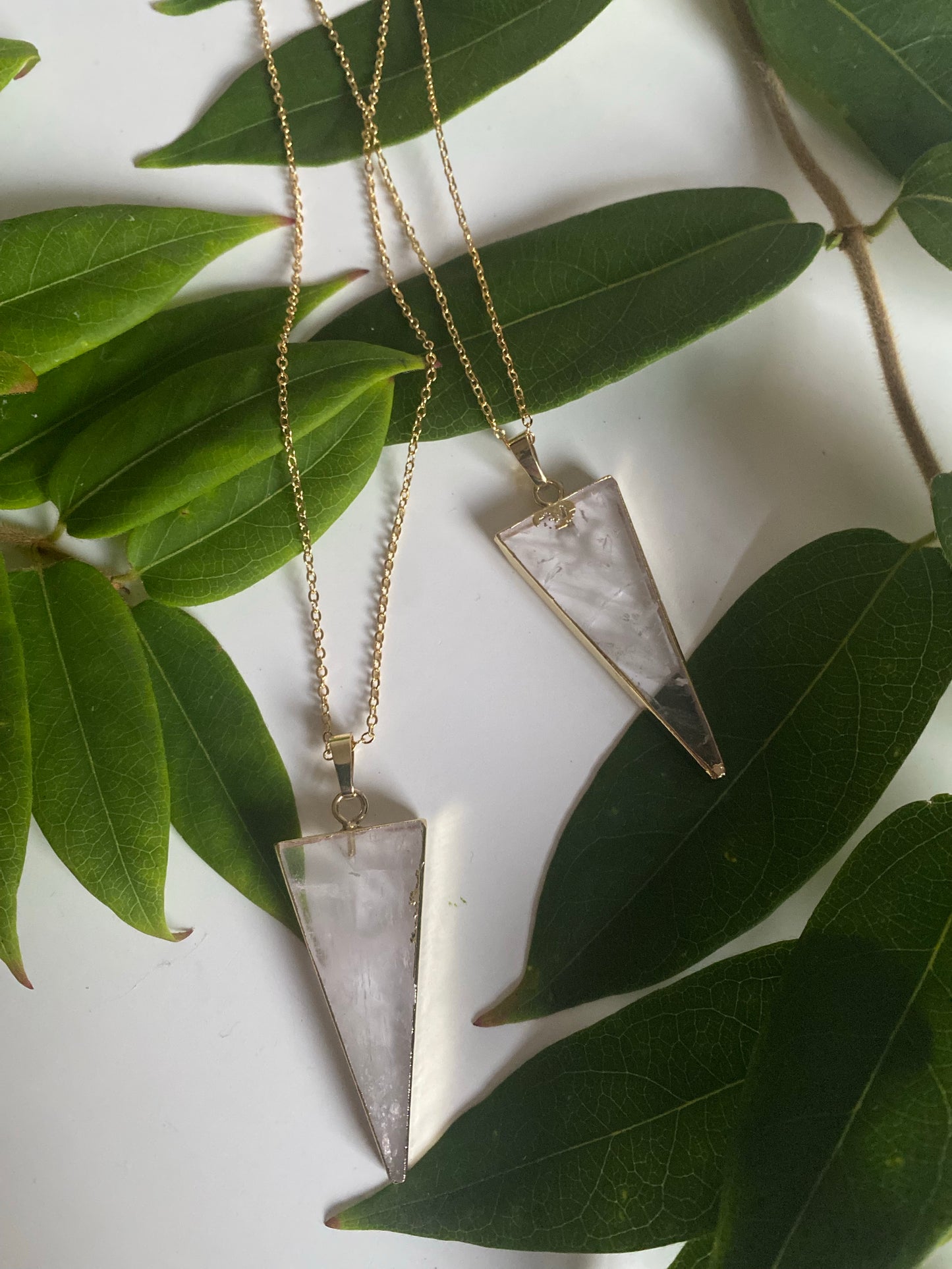 Clear Quartz triangle pendant on a gold plated necklace